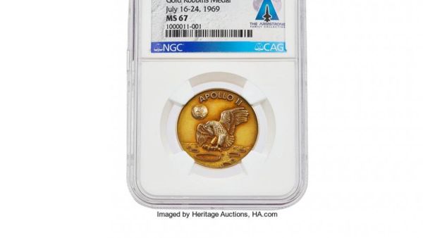 A gold medal Neil Armstrong carried while landing on the moon in the Apollo 11 mission sold for more than $2 million in an auction on Wednesday. (Photo courtesy Heritage Auctions )
