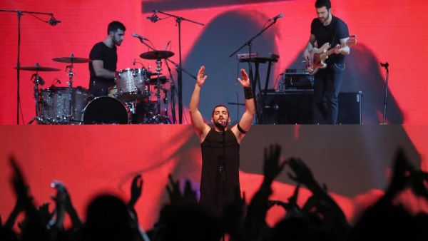 Hamed Sinno, the lead singer of Lebanese band Mashrou Leila, performs on stage at the Dubai International Marine Club. (Courtesy AFP / KARIM SAHIB)
