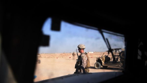 US Marines keep watch as unseen Afghan National Army soldiers  (AFP)