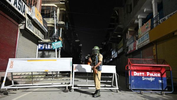 An Indian paramilitary trooper stands guard  (AFP)