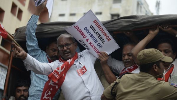 Members of the Communist Party of India are detained by police at a protest in Hyderabad  (AFP)