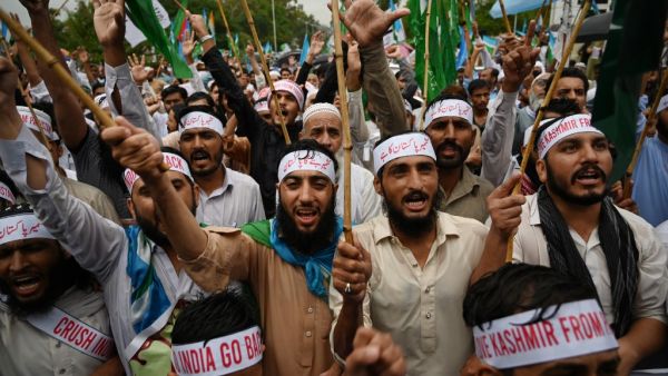 Supporters of the Pakistani political and Islamic party Jammat-e-Islami (JI) shout slogans as they march during an anti-Indian protest rally in Islamabad  (AFP)