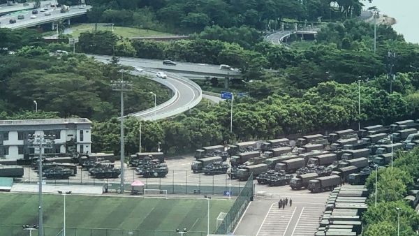 Trucks and armoured personnel carriers are seen outside the Shenzhen Bay stadium in Shenzhen, bordering Hong Kong in China's southern Guangdong province, on August 15, 2019. (AFP/ File Photo)