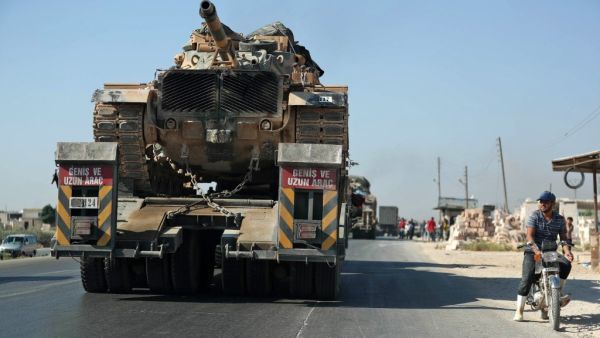 A convoy of Turkish military vehicles passes through the town of Saraqeb in the northwestern province of Idlib reportedly heading toward the town of Khan Sheikhun in the southern countryside of the province on August 19, 2019. (AFP/ File Photo)