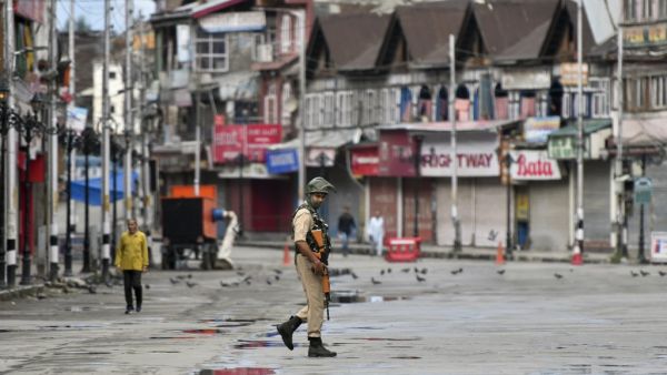 A security personnel patrols on a deserted road of the Lal Chowk area in Srinagar on August 19, 2019. (AFP/ File Photo) A security personnel patrols on a deserted road of the Lal Chowk area in Srinagar on August 19, 2019. (AFP/ File Photo)