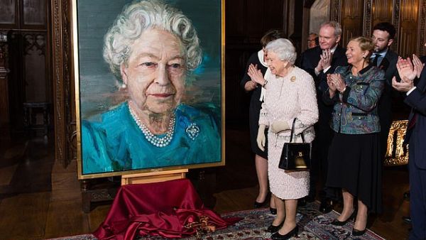 The Queen and the then deputy first minister of Northern Ireland Martin McGuinness, a former IRA commander, admire a portrait of the monarch in London in 2016. (Daily Mail)