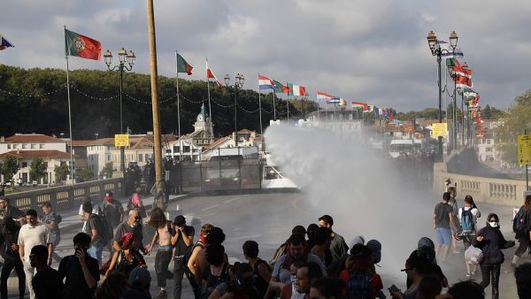 French security personnel fire a water canon during a protest in the city of Bayonne. (AFP/ File Photo)