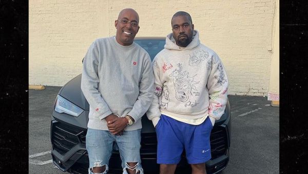 Kanye West Surprises Manager John Monopoly (Twitter)