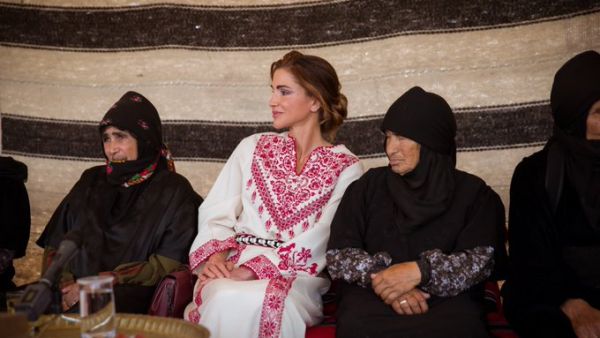 Queen Rania greets an elderly woman during a vist to Umm Al Rasas District in Amman on Wednesday. (Twitter/ @QueenRania)