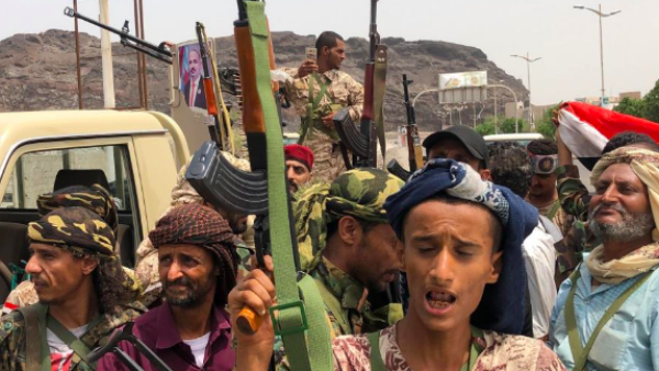 Yemeni supporters of the southern separatist movement pose for a picture in Khor Maksar, in the Yemeni southern port city of Aden on 10 August, 2019.