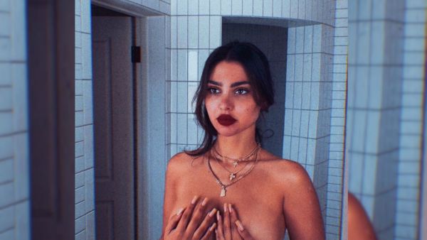 Amar posted a new photo in which she is taking off her clothes (Source: singeramar - Instagram)