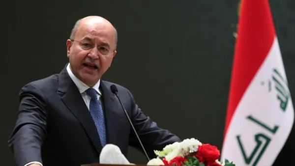 Iraqi President Barham Salih delivering a speech on 2 October, 2018 at the parliament in Baghdad (AFP)