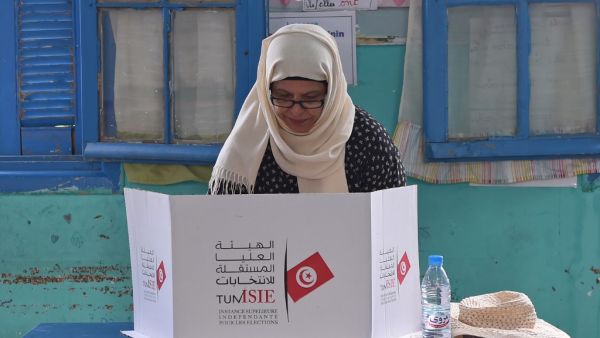 A Tunisian voter fills her ballot for presidential election at a polling station in Ben Arous near the capital Tunis, on September 15, 2019. (AFP/ File Photo)