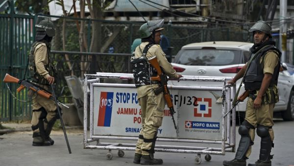 Security personnel stand guard to block a road while strict restrictions are imposed during a lockdown in Srinagar on September 28, 2019. Tauseef MUSTAFA / AFP Security personnel stand guard to block a road while strict restrictions are imposed during a lockdown in Srinagar on September 28, 2019. Tauseef MUSTAFA / AFP