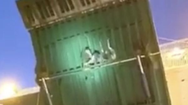 Stowaways were spotted clinging onto the gangway as ferry reached Malaga. (Video Screenshot) Stowaways were spotted clinging onto the gangway as ferry reached Malaga. (Video Screenshot)