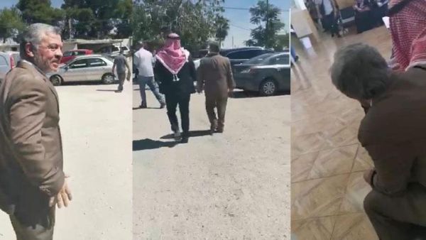 King Abdullah is seen walking in the parking lot of the north Amman Department of Land and Survey during an undercover visit recently (jordantimes)