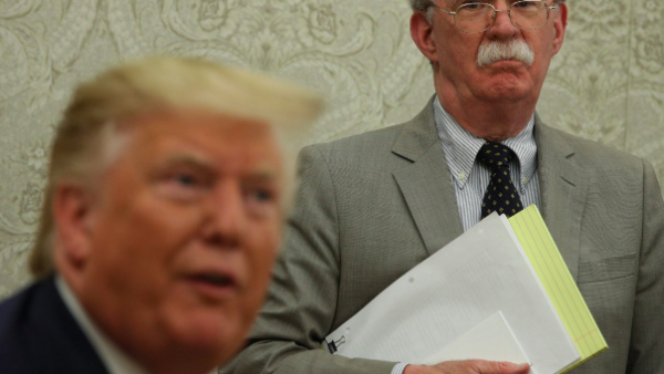 Trump (L), Bolton two faces of US foreign policy 