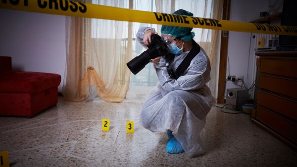 Forensics researcher photographing a blood at a murder scene. (Shutterstock/ File Photo) Forensics researcher photographing a blood at a murder scene. (Shutterstock/ File Photo)