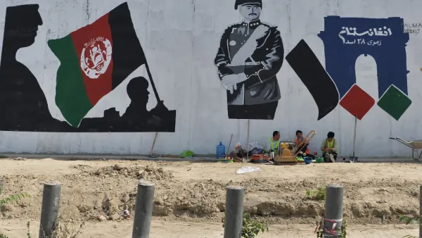 Workers take rest next to a mural of late king of Afghanistan Aman Ullah Khan, who led the successful war for Afghanistan's independence from British Rule in 1919, the day after Afghanistan held presidential elections, in Kabul on September 29, 2019. (AFP/ File Photo)