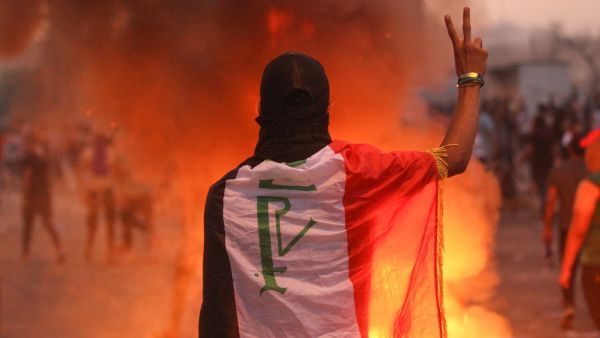 An Iraqi protester gestures the v-sign during a demonstration against state corruption, failing public services and unemployment at Tayaran square in Baghdad on October 2, 2019. (AFP/ File Photo)
