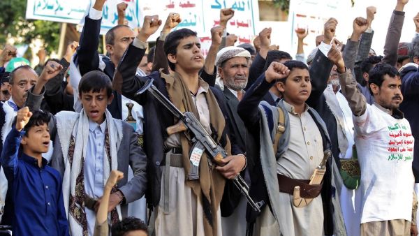 Supporters of Yemen's Shiite Huthi rebels chant slogans and raise signs showing the group's flag, reading in Arabic "God is Great, death to America, death to Israel, curse upon the Jews, victory to Islam", as they gather for a rally in support of the group in the Huthi-held capital Sanaa on October 4, 2019. MOHAMMED HUWAIS / AFP