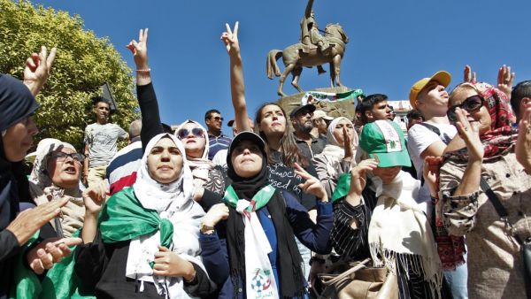 Algerian protesters gesture during an anti-government protest in the capital Algiers on October 8, 2019. Demonstrators gathered in the capital, the epicentre of Algeria's protest movement that forced longtime president Abdelaziz Bouteflika to step down in April. (STRINGER / AFP)