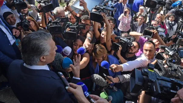 Tunisian presidential candidate Nabil Karoui speaks to journalists in front of his party's office in the capital Tunis on October 10, 2019, a day after his release from jail. AFP