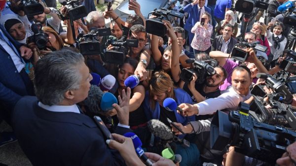 Tunisian presidential candidate Nabil Karoui speaks to journalists in front of his party's office in the capital Tunis on October 10, 2019, a day after his release from jail. AFP