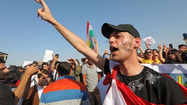 A Kurdish man shouts slogans during a demonstration in Arbil, the capital of the northern Iraqi Kurdish autonomous region (AFP)