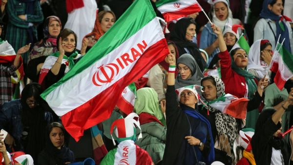 Iranian women cheer ahead of the World Cup Qatar 2022 Group C qualification football match between Iran and Cambodia at the Azadi stadium in the capital Tehran on October 10, 2019. (AFP/File)