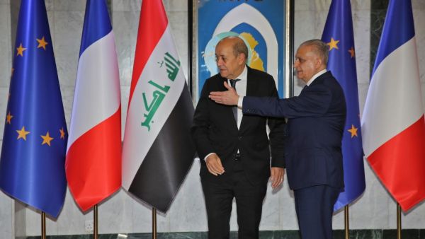 Iraqi Foreign Minister Mohammed Ali al-Hakim (R) meets his French counterpart Jean-Yves Le Drian in Baghdad on October 17, 2019. SABAH ARAR / AFP