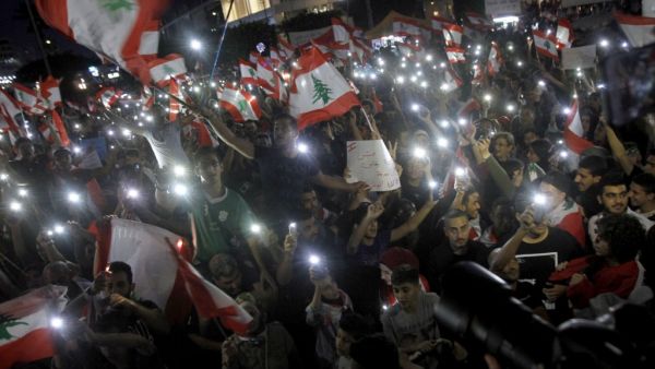 Lebanese protestors gather during demonstrations to demand better living conditions and the ouster of a cast of politicians who have monopolised power and influence for decades, on October 22, 2019 in the southern city of Sidon. (AFP/ File Photo)
