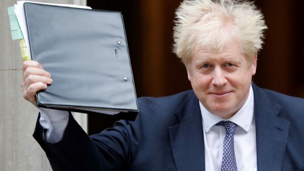 Britain's Prime Minister Boris Johnson reacts as he leaves from 10 Downing Street in central London on October 23, 2019, before heading to the House of Commons for Prime Minister's Questions (PMQS). British Prime Minister Boris Johnson said Tuesday he will pause efforts to pass his Brexit deal, after MPs gave their preliminary approval for it but rejected his timetable to push it through parliament this week. The president of the European Council, Donald Tusk, recommended that EU leaders postpone Britain's departure from the bloc while its prime minister seeks approval of their divorce deal. Tolga AKMEN / AFP Britain's Prime Minister Boris Johnson reacts as he leaves from 10 Downing Street in central London on October 23, 2019, before heading to the House of Commons for Prime Minister's Questions (PMQS). British Prime Minister Boris Johnson said Tuesday he will pause efforts to pass his Brexit deal, after MPs gave their preliminary approval for it but rejected his timetable to push it through parliament this week. The president of the European Council, Donald Tusk, recommended that EU leaders postpone Britain's