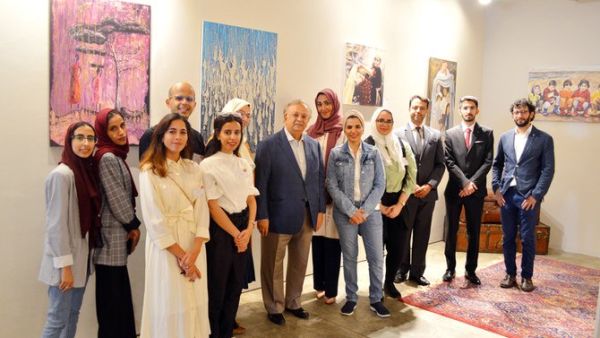 Saudi Arabia’s permanent representative to the UN Abdallah Al-Mouallimi, center, with the exhibition’s volunteers and guests on the opening day. (Photo/Supplied/ Arab News))
