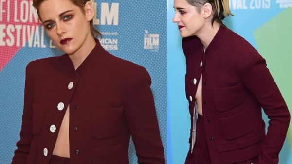 Racy: The actress, 29, teased her taut midriff and risked a wardrobe malfunction in an unbuttoned scarlet blazer adorned with white buttons. (Daily Mail/ Dave Benett/Wire Image)