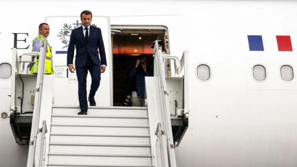 French President Emmanuel Macron disembarks from his plane after he landed at the Saint-Denis de la Reunion's airport on October 23, 2019 in the French overseas island of La Reunion as part of a four day trip in France's Indian Ocean overseas territories. Richard BOUHET / AFP