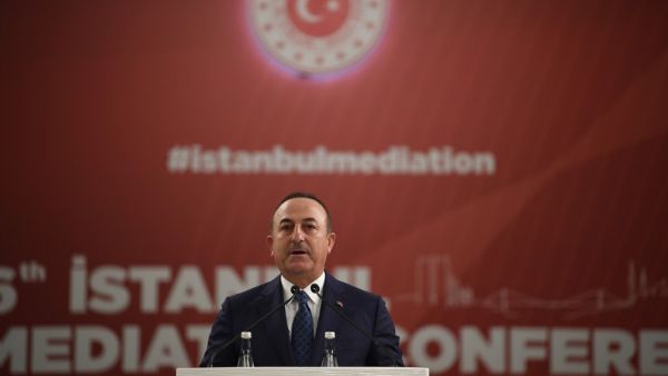Turkish Foreign Minister Mevlut Cavusoglu speaks as the U.N. Secretary General listens on during the Third OIC Member States Conference on Mediation in Istanbul, on October 31, 2019. BULENT KILIC / AFP