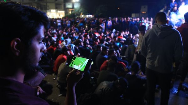 Protesters gather at a square in Iraq's central shrine city of Karbala to watch the the Group C FIFA World Cup 2022 qualifying football match between Iraq and Iran taking place in the Amman International Stadium in the Jordanian capital on November 14, 2019. Mohammed SAWAF / AFP