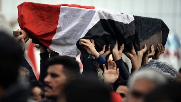 Young Iraqis carry the coffin of an anti-government demonstrator killed during protests a day earlier, during a funeral procession in the central holy shrine city of Najaf on November 29, 2019. Nearly 45 people were reportedly killed and hundreds wounded across Iraq yesterday, at least 16 of them in Najaf, a day after the torching of Iran's consulate there. Haidar HAMDANI / AFP