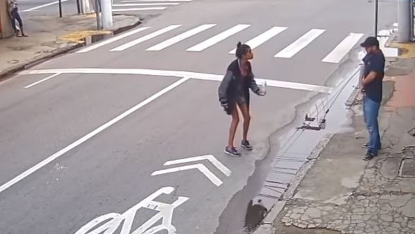 Dos Santos Leandro (center) apparently argued with de Castro (right) before he reached for a gun and shot her dead. (Video Screenshot)