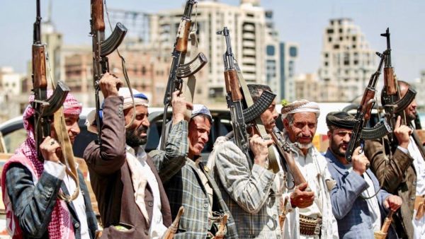 Houthi rebels hold up Kalashikov assault rifles at meeting in capital Sanaa on Saturday (AFP)
