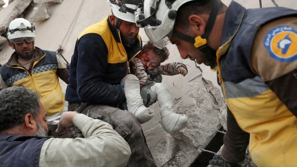 Members of the Syrian Civil Defense (White Helmets) and locals carry a child injured in a reported Russian airstrike on Marayan village in the northwestern Idlib governorate, on november 22, 2019. (AFP/ File Photo)