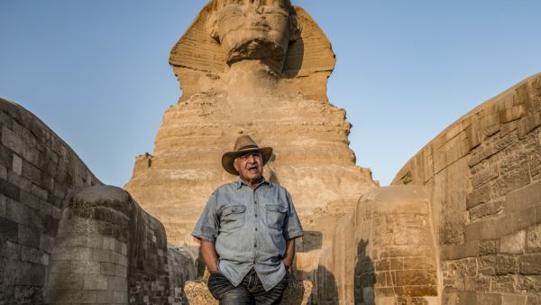 Zahi Hawass, Egyptian archaeologist and former antiquities minister, stands before the Great Sphinx of Giza during a lecture with a tourist group on ancient Egyptian history, at the Giza Necropolis on the southeastern outskirts of the capital on November 20, 2019. (AFP/ File Photo)