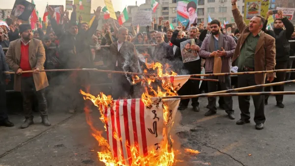Iranian pro-government demonstrators burn makeshift US flags as they gather in the capital Tehran's central Enghelab Square on November 25, 2019, to condemn days of "rioting" that Iran blames on its foreign foes. (AFP/ File Photo)