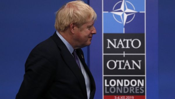 Britain's Prime Minister Boris Johnson waits for arrivals at the NATO summit at the Grove hotel in Watford, northeast of London on December 4, 2019. Adrian DENNIS / AFP