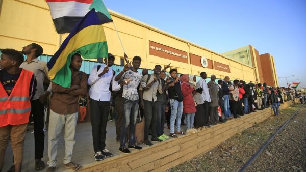 Sudanese protesters wait at a train station in Khartoum to board a train to Atbara on December 19, 2019 to celebrate the one-year anniversary of their protest movement that brought down Omar al-Bashir last April after a thirty-year rule. A year after demonstrations broke out in Sudan over soaring bread prices, celebrations are planned across the country to mark the uprising that brought down veteran autocrat Bashir.  ASHRAF SHAZLY / AFP