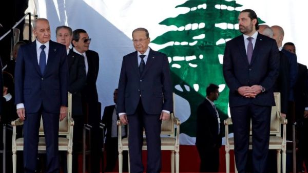 Lebanese Prime Minister Saad Hariri (R), President Michel Aoun (C) and House Speaker Nabih Berri (L) attend a military parade to celebrate the 75th anniversary of Lebanon's independence in downtown Beirut, on November 22, 2018 (AFP Photo/ANWAR AMRO)