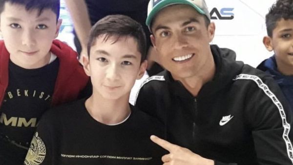 Ali Turganbekov, a boy from Kazakhstan who was born without legs, finally got to play football with his hero, Cristiano Ronaldo (Twitter)