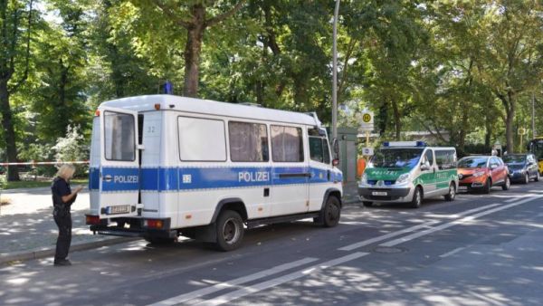Picture taken on August 23, 2019 shows police cars parked close to the site of a crime scene in Berlin's Moabit district, where a man of Georgian origin was shot dead. (DPA/AFP via Getty Images)