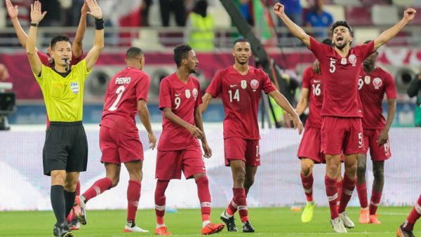 Qatar players cheer as Japanese referee Ryuji Sato signals the end of the 24th Arabian Gulf Cup Group A football match between Qatar and the United Arab Emirates at the Khalifa International Stadium in the Qatari capital Doha on December 2, 2019. KARIM JAAFAR / AFP